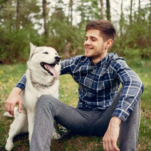 handsome-guy-in-a-summer-park-with-a-dog-2022-02-02-05-09-48-utc-min